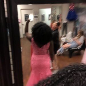 It is a pink prom dress size extra large brand “Let’s”